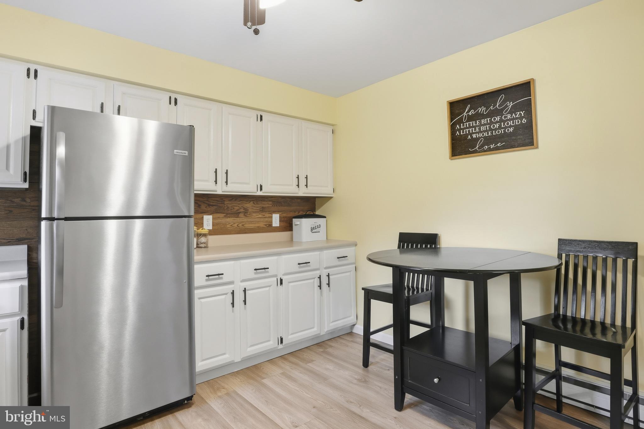 935 Pleasant Grove Road Red Lion, PA 17356 - Photo 10 of 70 a kitchen with stainless steel appliances a refrigerator a sink and white cabinets