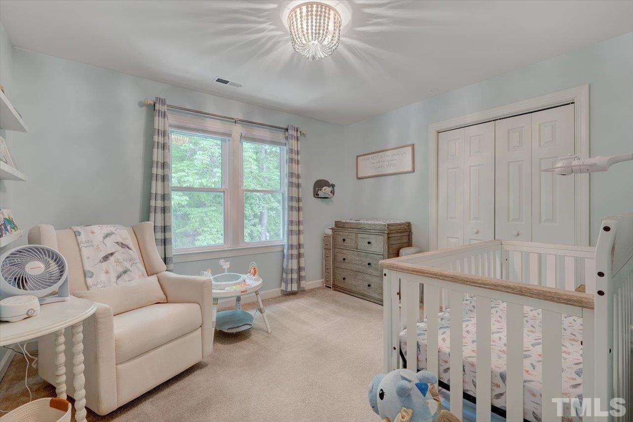 22 Swallows Ridge Court Durham, NC 27713 - Photo 28 of 33 a bed room with furniture and a window