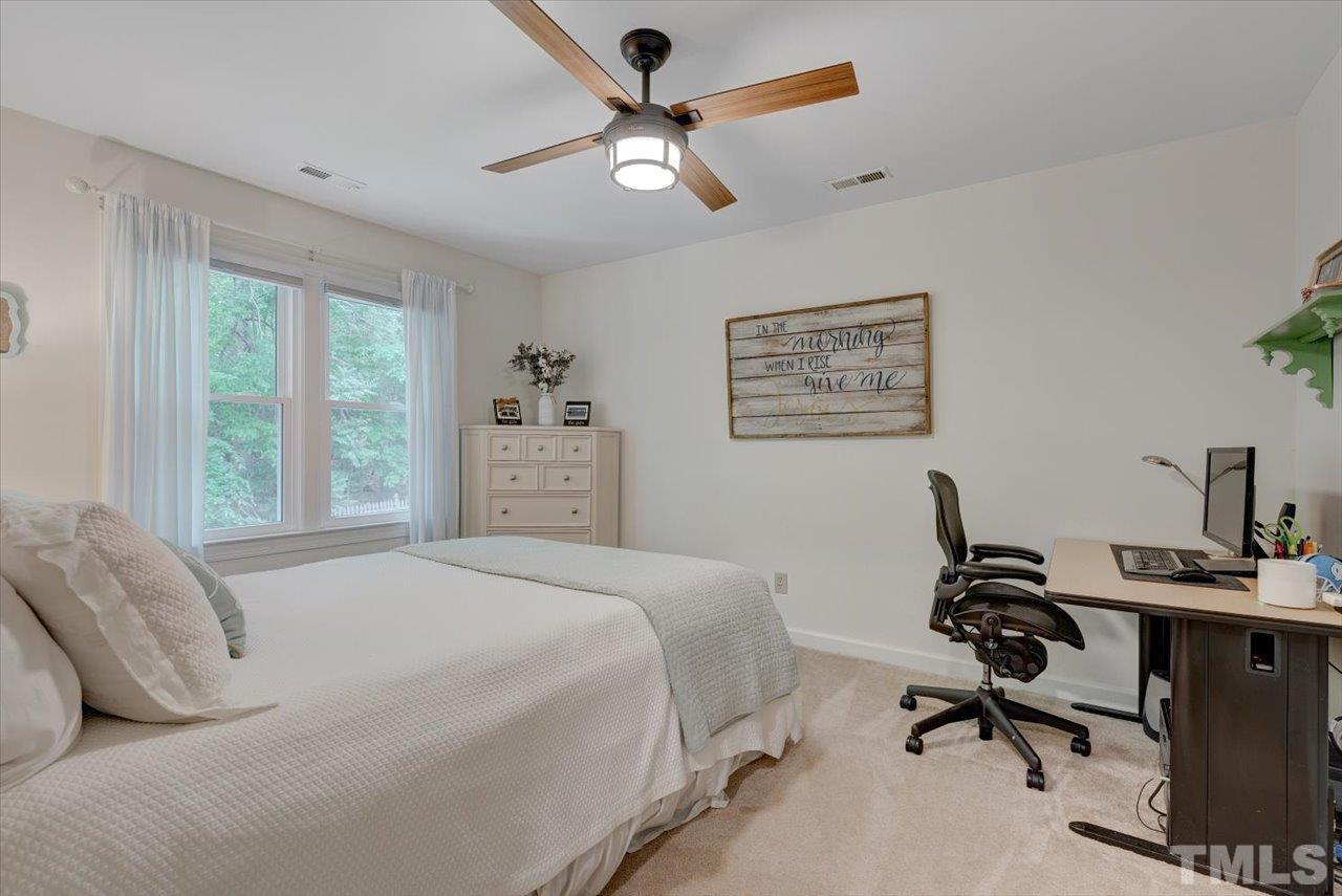 22 Swallows Ridge Court Durham, NC 27713 - Photo 29 of 33 a bedroom that has a bed and a desk in it