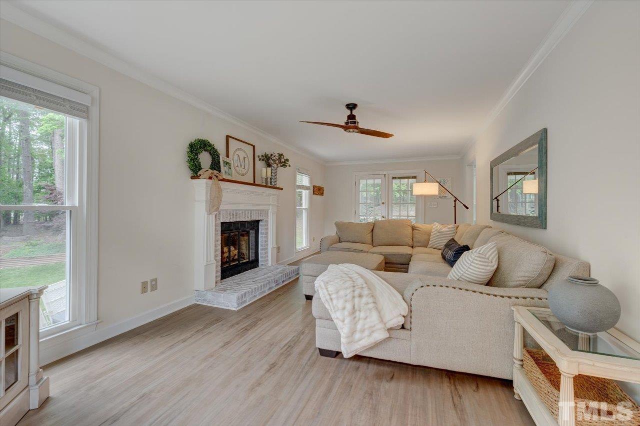22 Swallows Ridge Court Durham, NC 27713 - Photo 5 of 33 a living room with furniture and a fireplace