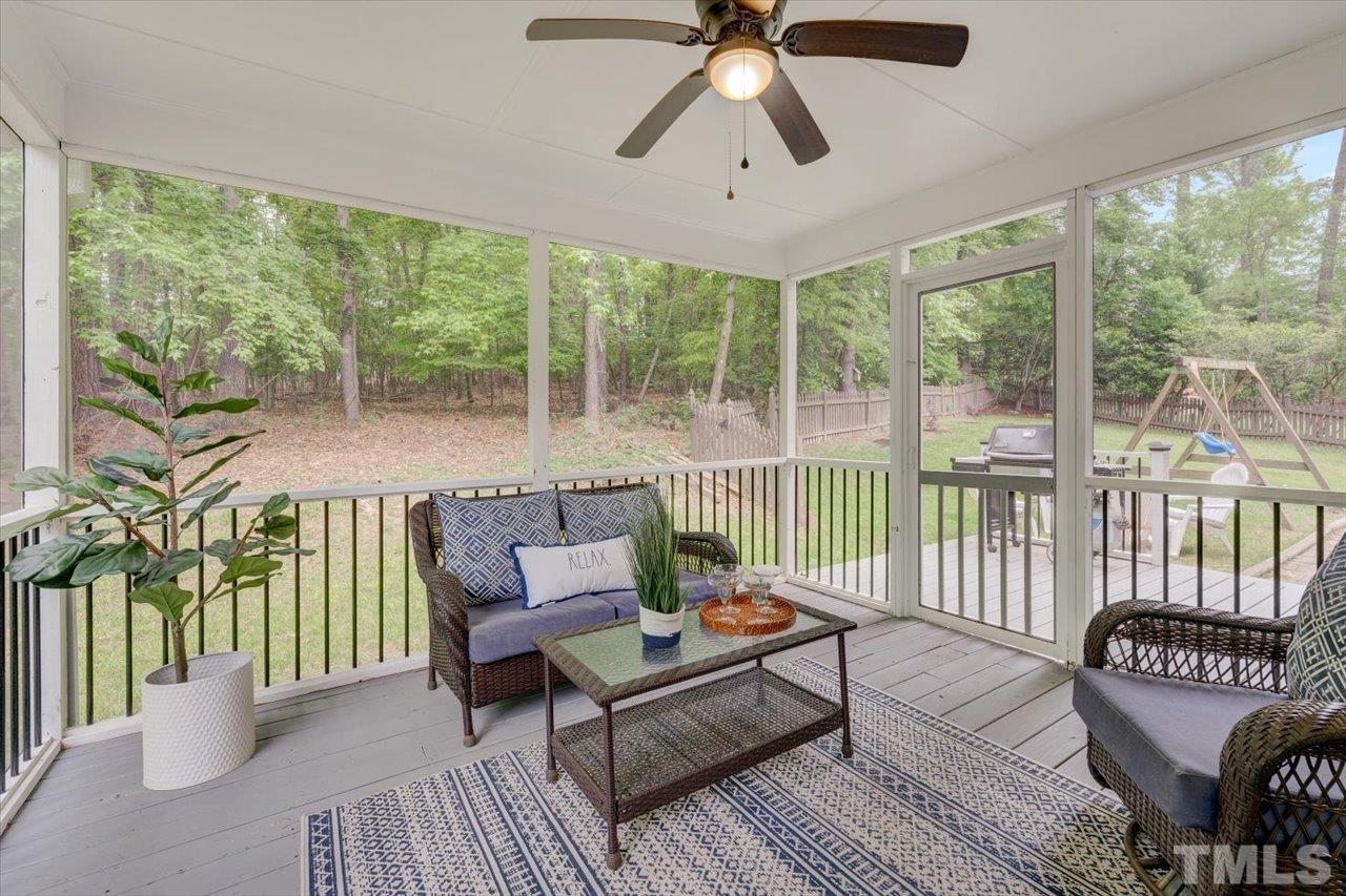22 Swallows Ridge Court Durham, NC 27713 - Photo 9 of 33 a balcony with furniture and a potted plant