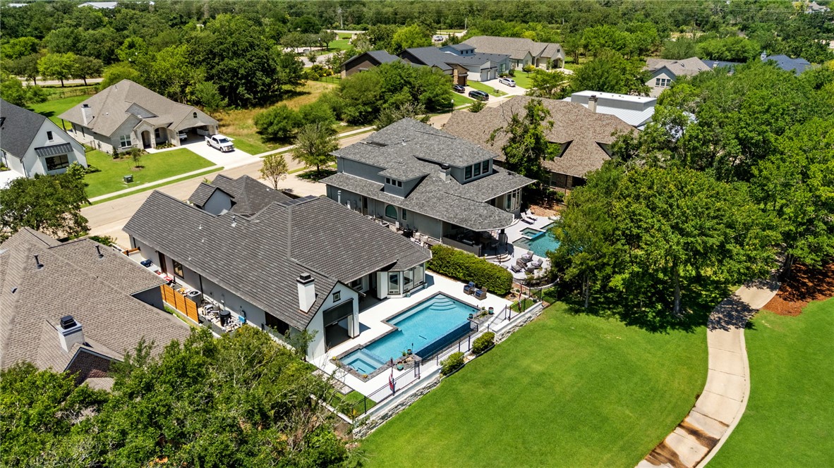 2833 Persimmon Ridge Court Bryan, TX 77807 - Photo 5 of 50 an aerial view of a house with a garden