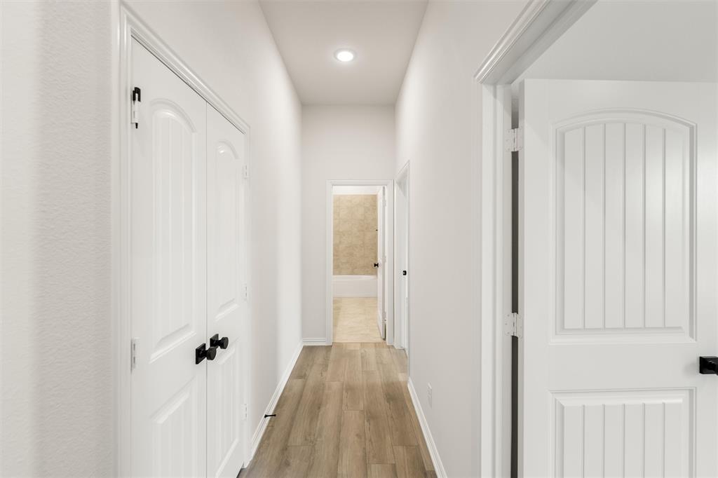 125 Snowy Owl Trail Rhome, TX 76078 - Photo 20 of 28 Corridor featuring light wood-style floors and recessed lighting