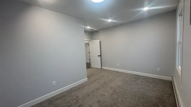 a bathroom with a sink mirror vanity and toilet