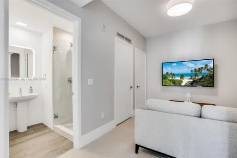 a bathroom with a sink a mirror and a shower