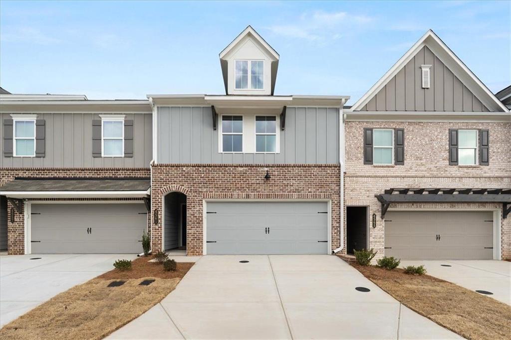 a front view of a house with a garage