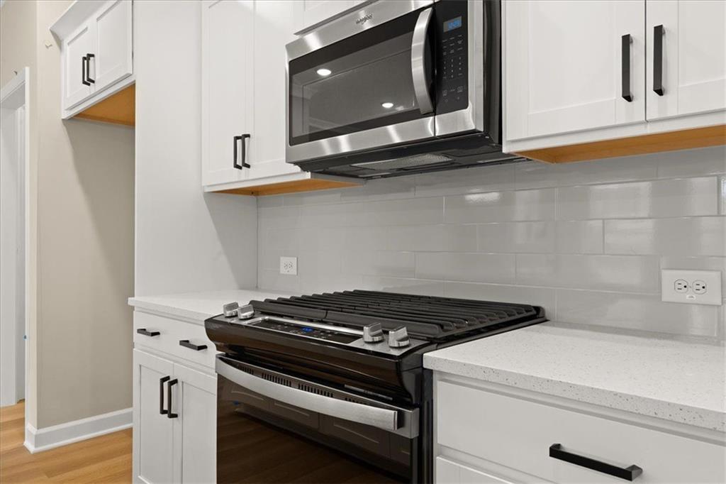 4561 Moray Drive Mableton, GA 30126 - Photo 11 of 34 a stove top oven sitting inside of a kitchen