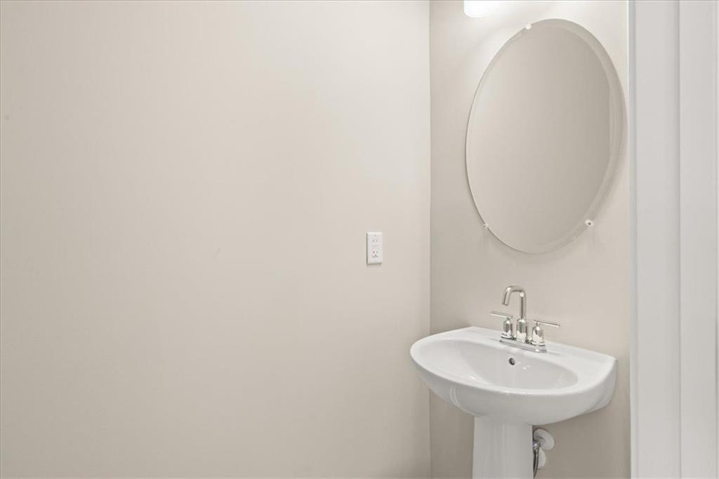 4561 Moray Drive Mableton, GA 30126 - Photo 13 of 34 a bathroom with a sink a mirror and a toilet