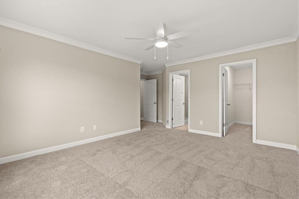 4561 Moray Drive Mableton, GA 30126 - Photo 15 of 34 a view of an empty room with a ceiling fan