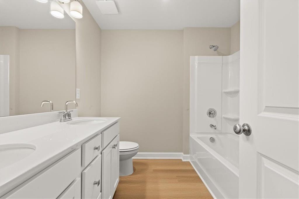 4561 Moray Drive Mableton, GA 30126 - Photo 23 of 34 a bathroom with a sink a toilet and shower