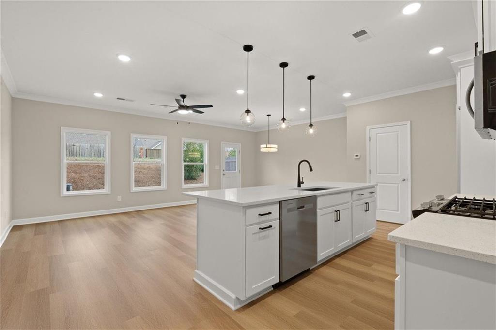 4561 Moray Drive Mableton, GA 30126 - Photo 5 of 34 a large kitchen with kitchen island a sink stainless steel appliances and cabinets
