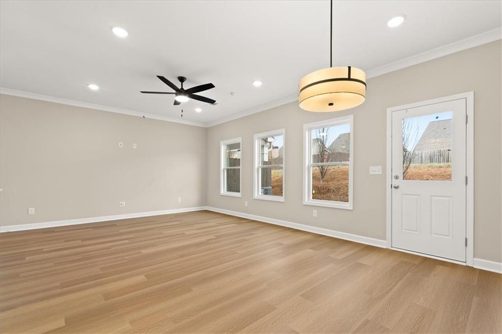 4561 Moray Drive Mableton, GA 30126 - Photo 6 of 34 an empty room with wooden floor and windows