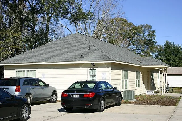 a view of a car parked in front of a house