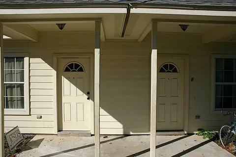 a front view of a house with a garage