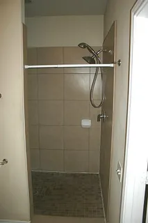 a bathroom with a glass shower door