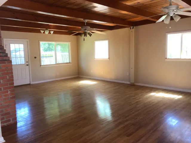 a kitchen with stainless steel appliances granite countertop a refrigerator sink and cabinets