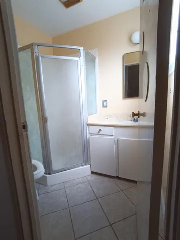 a bathroom with a sink a mirror and a vanity