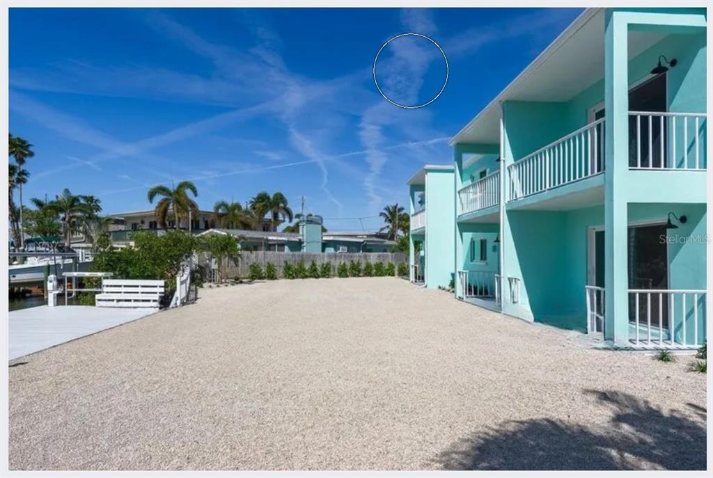 500 129th Avenue East, Unit 1 Madeira Beach, FL 33708 - Photo 18 of 19 a view of a house with a patio