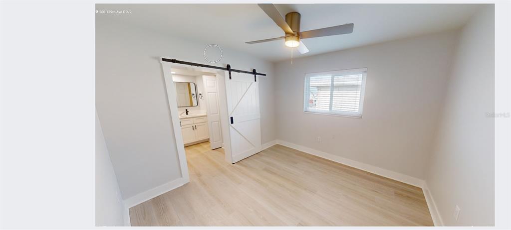 500 129th Avenue East, Unit 1 Madeira Beach, FL 33708 - Photo 10 of 19 a view of an empty room with a window