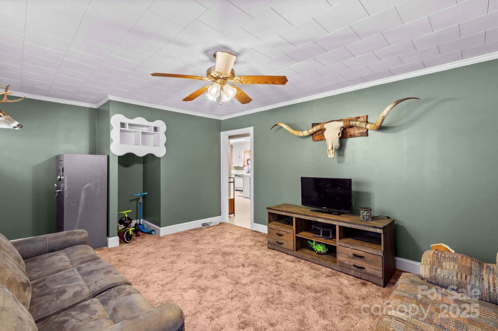 185 Homer Corriher Road China Grove, NC 28023 - Photo 13 of 48 a bedroom with furniture and a flat screen tv