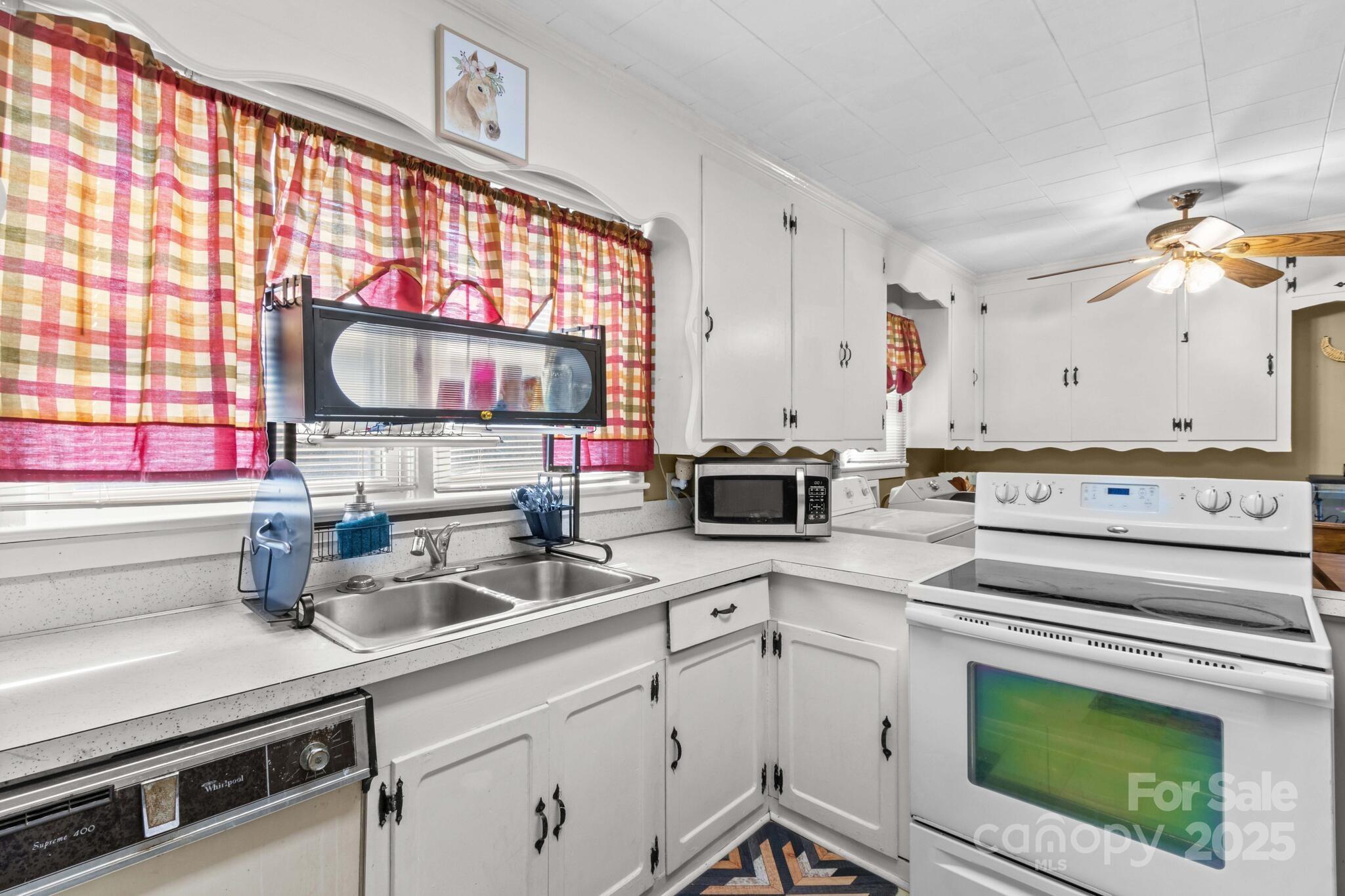 185 Homer Corriher Road China Grove, NC 28023 - Photo 21 of 48 a kitchen with a sink a stove and cabinets