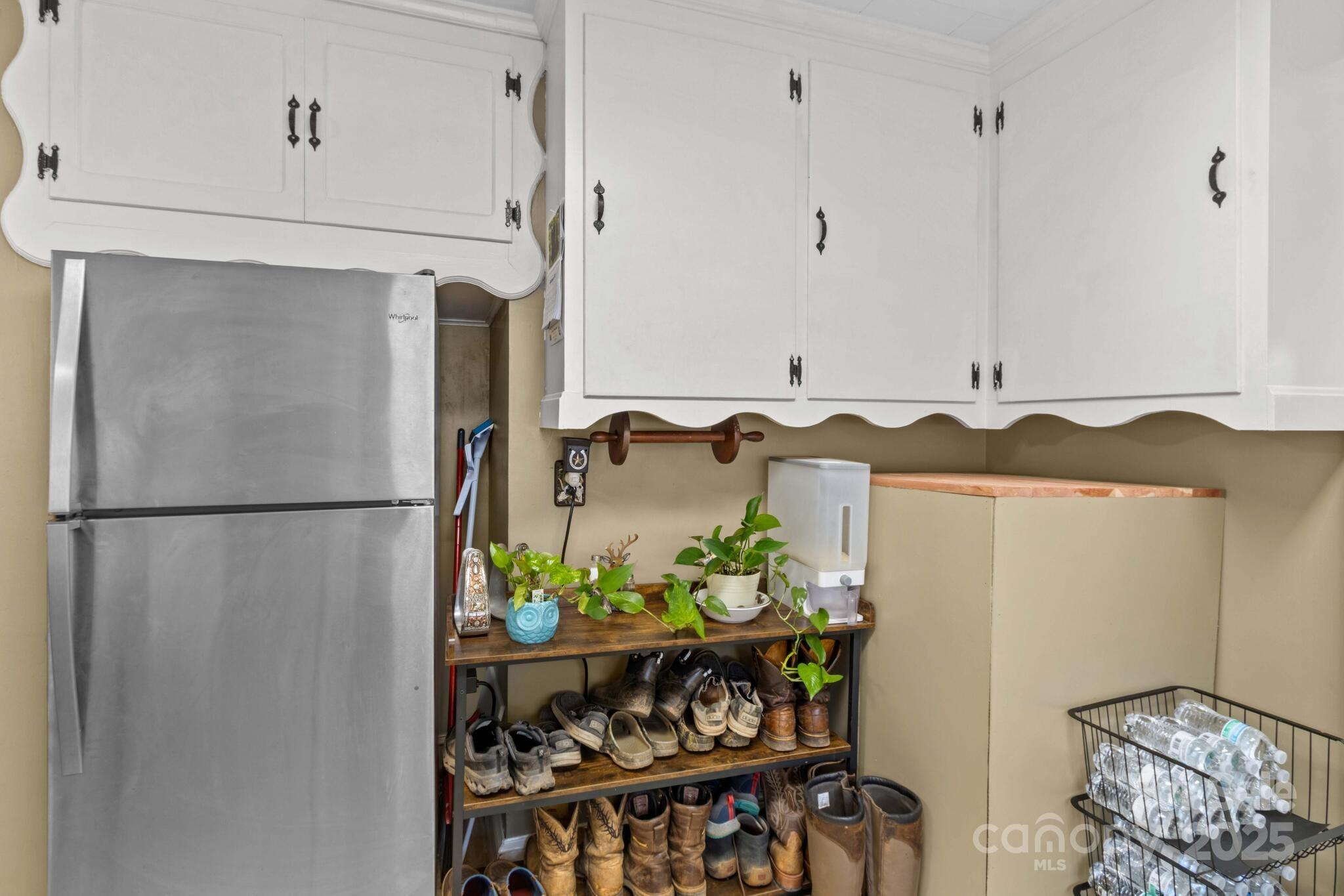 185 Homer Corriher Road China Grove, NC 28023 - Photo 23 of 48 a white refrigerator freezer sitting inside of a kitchen