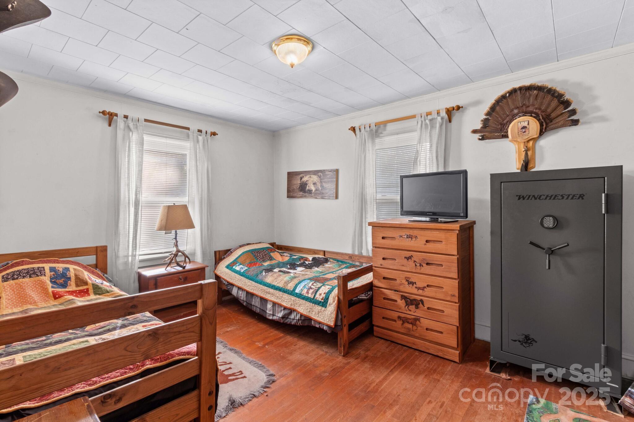 185 Homer Corriher Road China Grove, NC 28023 - Photo 26 of 48 a bedroom with furniture and flat screen tv