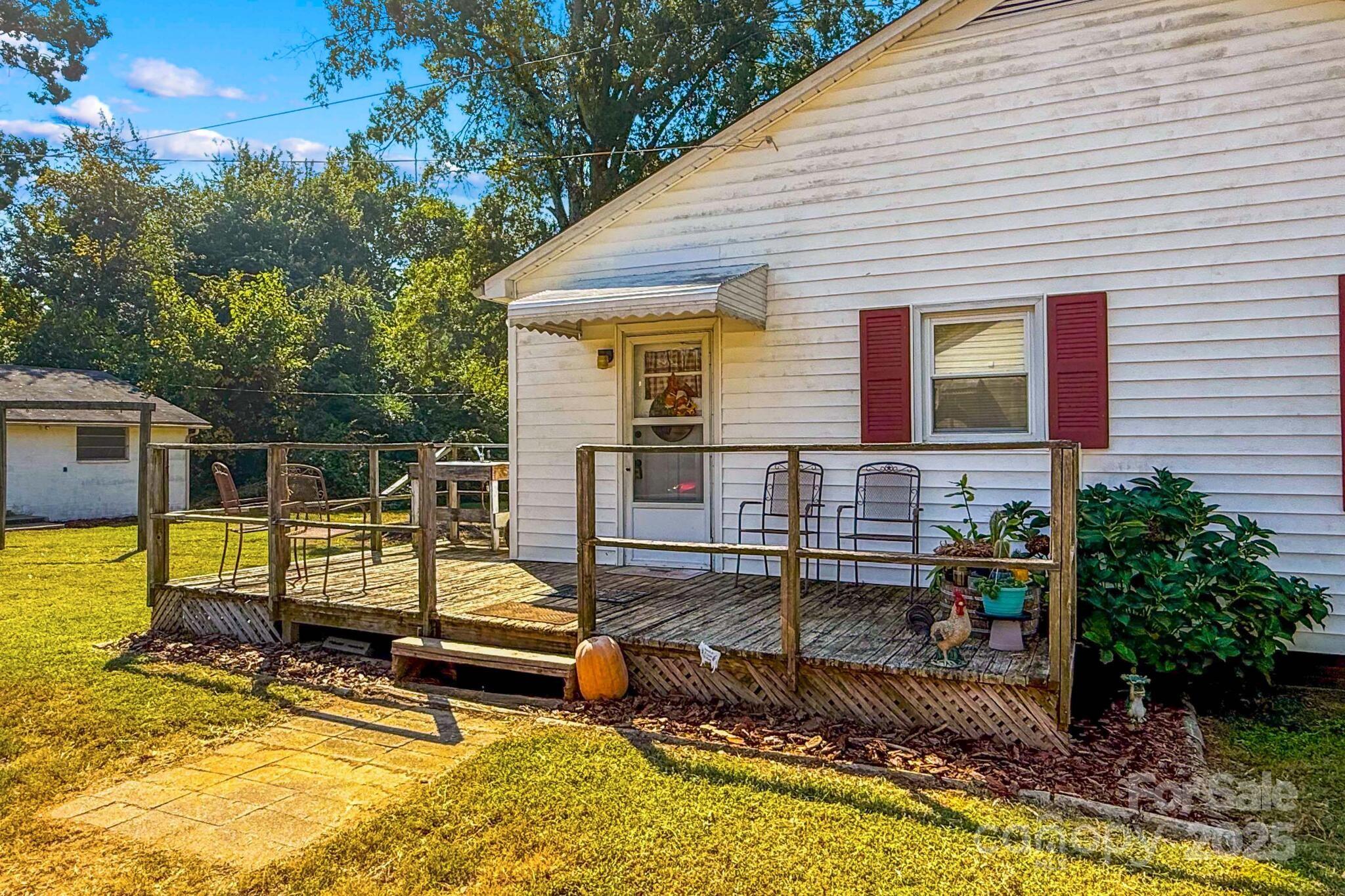 185 Homer Corriher Road China Grove, NC 28023 - Photo 28 of 48 a view of a house with backyard and sitting area
