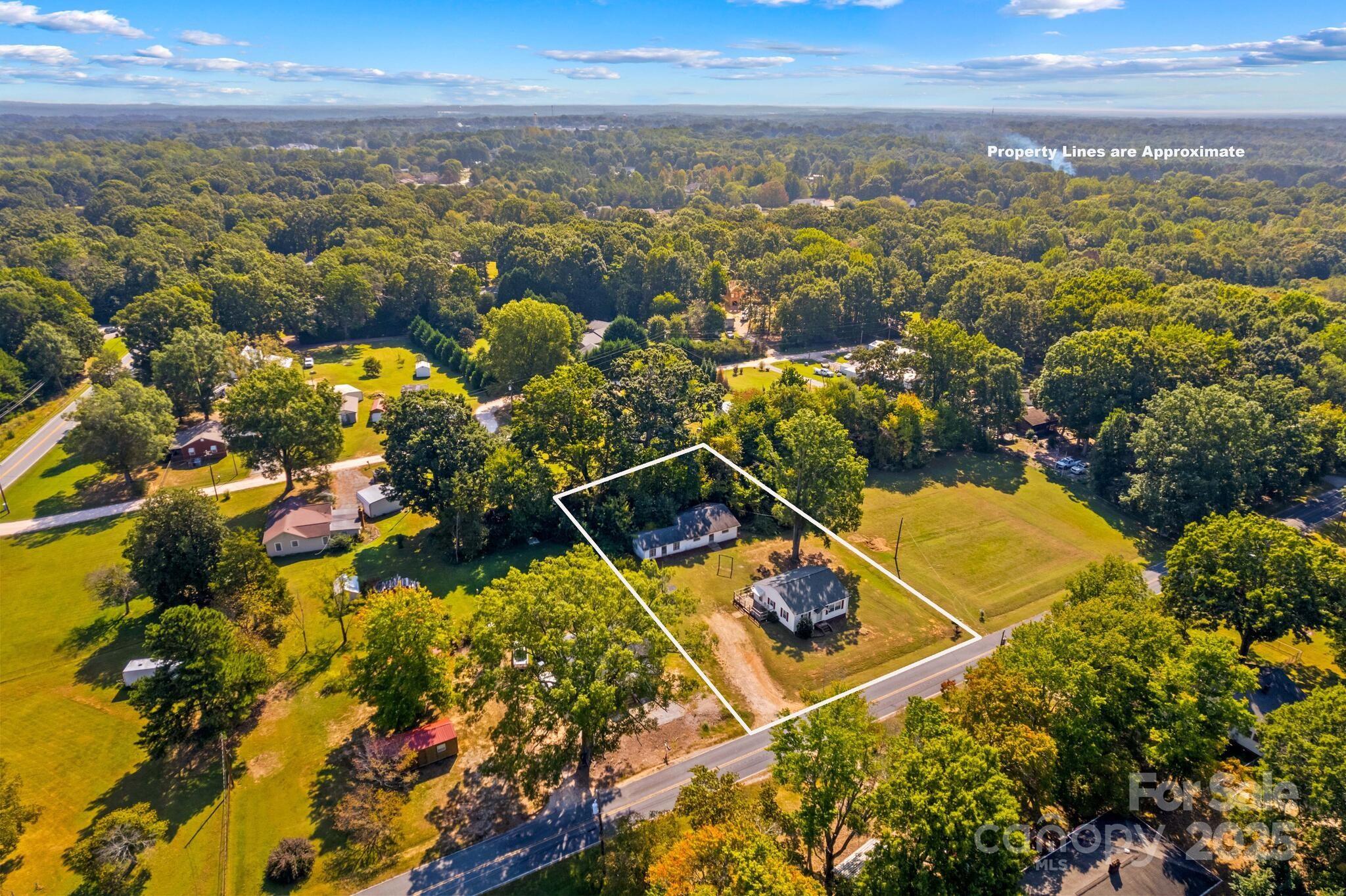 185 Homer Corriher Road China Grove, NC 28023 - Photo 3 of 48 an aerial view of residential houses with outdoor space