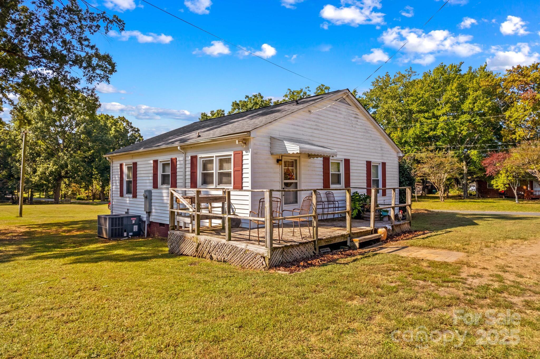 185 Homer Corriher Road China Grove, NC 28023 - Photo 31 of 48 a view of a house with a yard patio and swimming pool