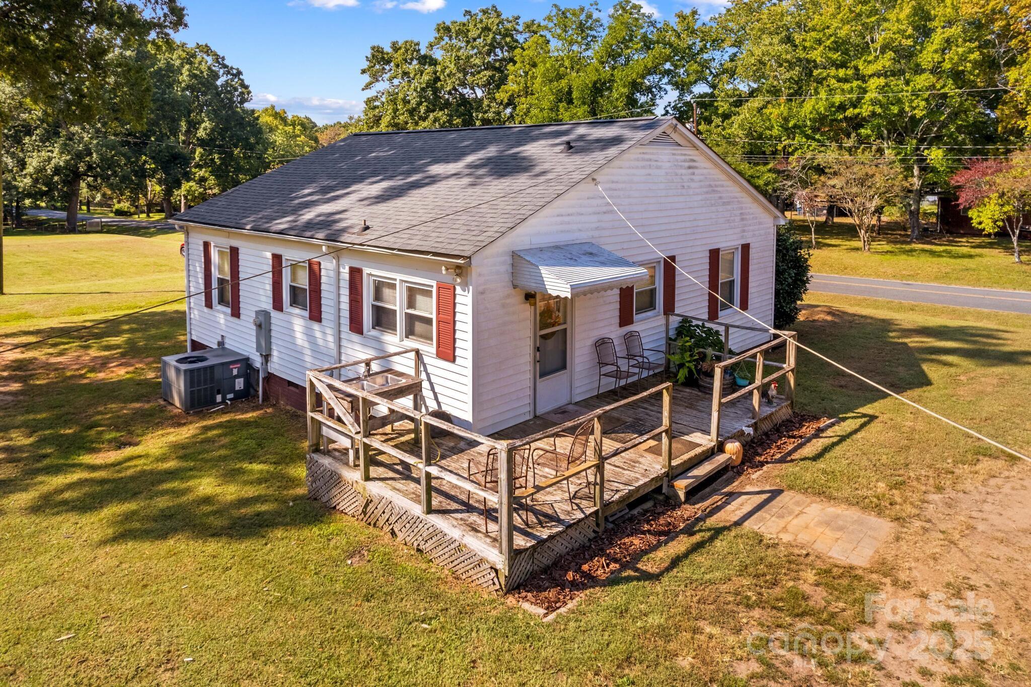 185 Homer Corriher Road China Grove, NC 28023 - Photo 32 of 48 a view of a house with pool and sitting area