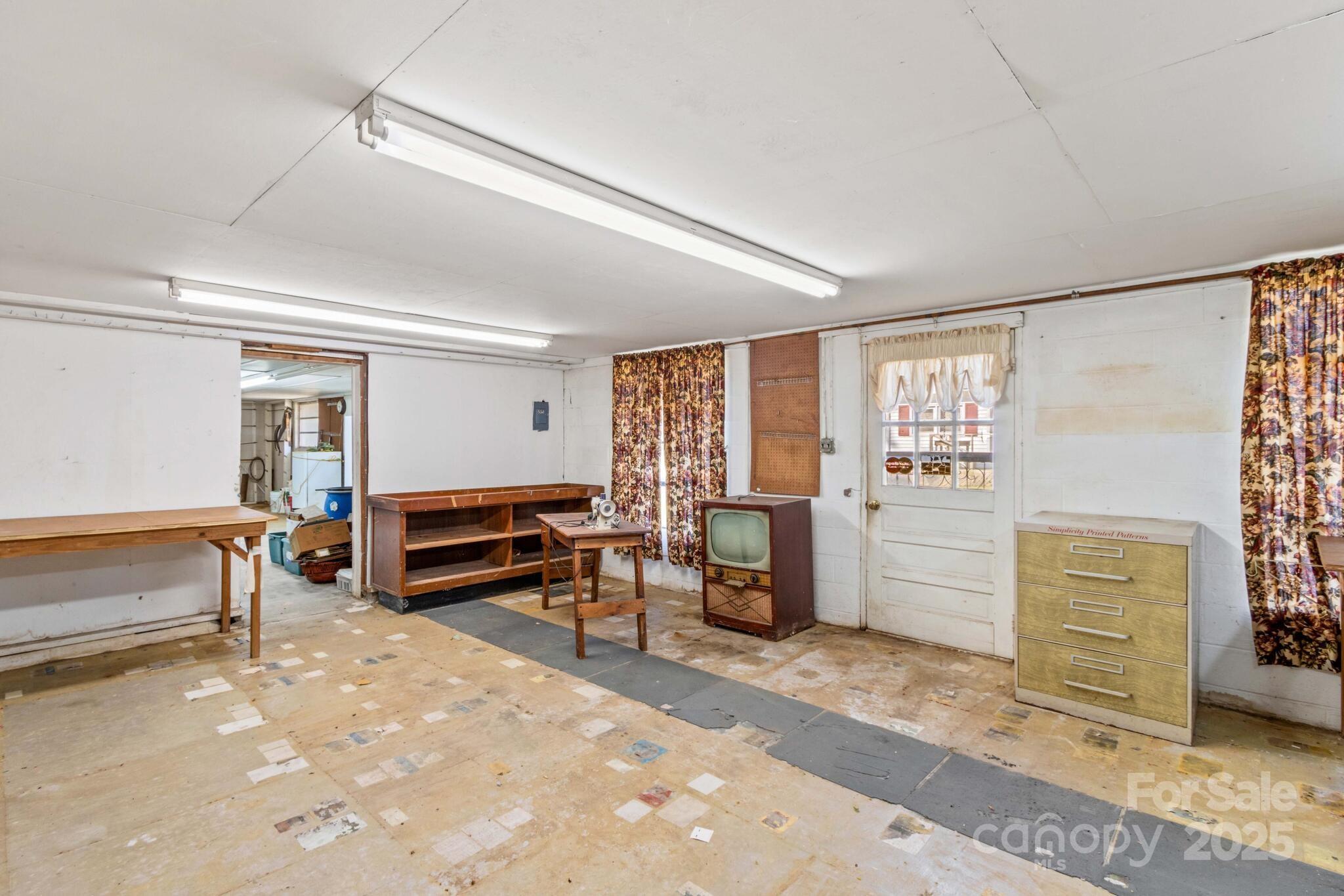 185 Homer Corriher Road China Grove, NC 28023 - Photo 38 of 48 a bedroom with furniture and a window