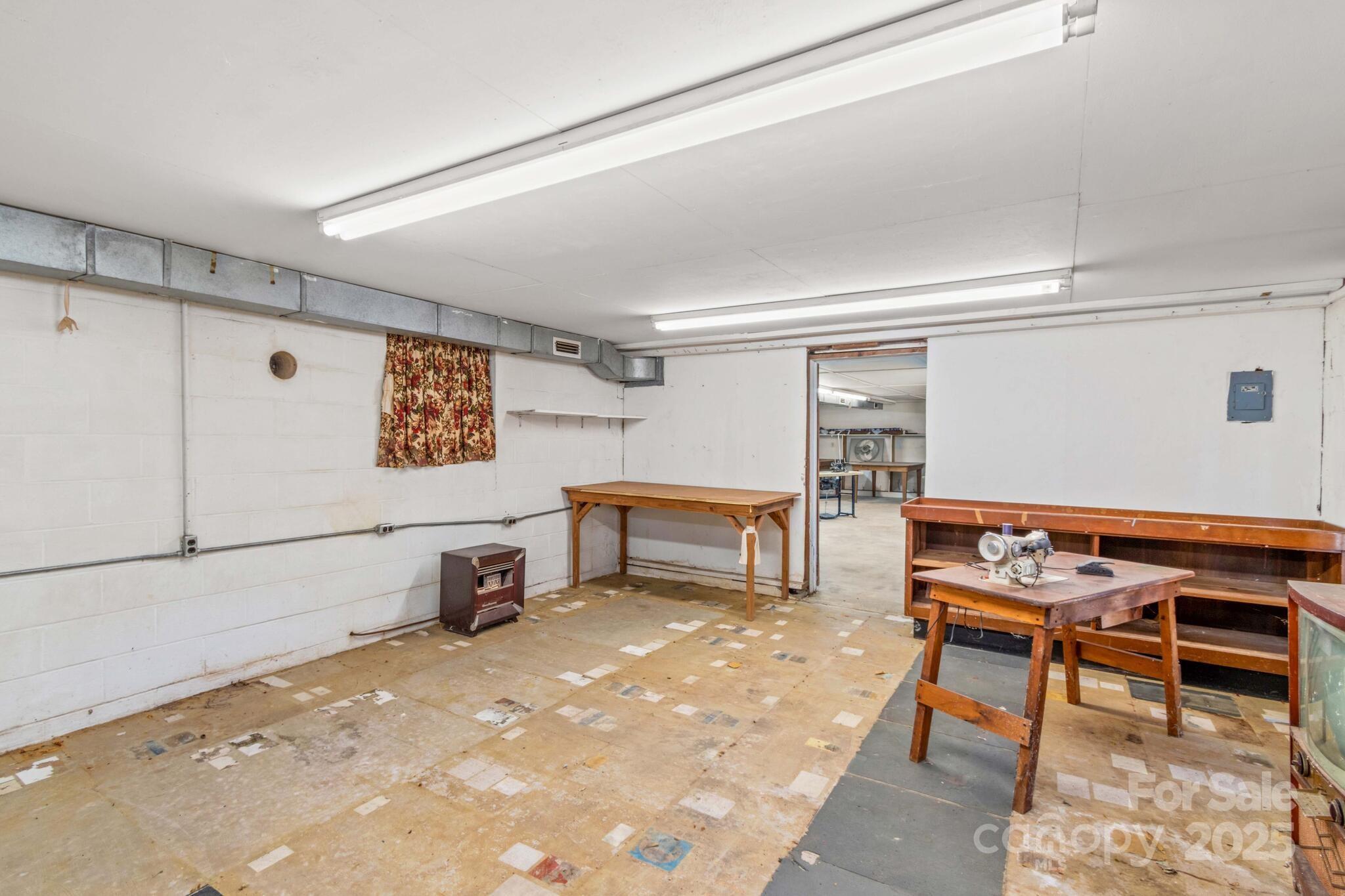 185 Homer Corriher Road China Grove, NC 28023 - Photo 39 of 48 a room with furniture a window and storage