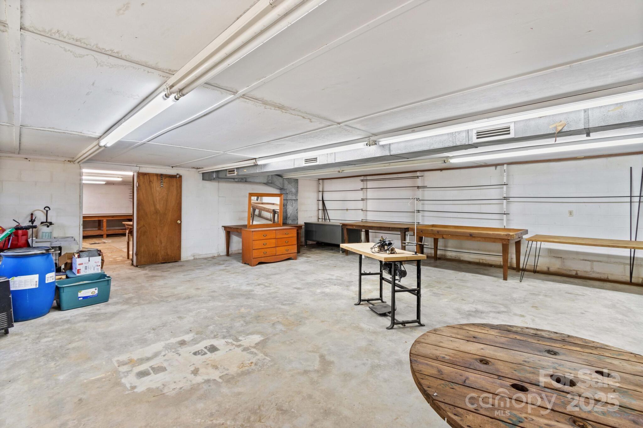 185 Homer Corriher Road China Grove, NC 28023 - Photo 42 of 48 a living room with furniture and a wooden floor