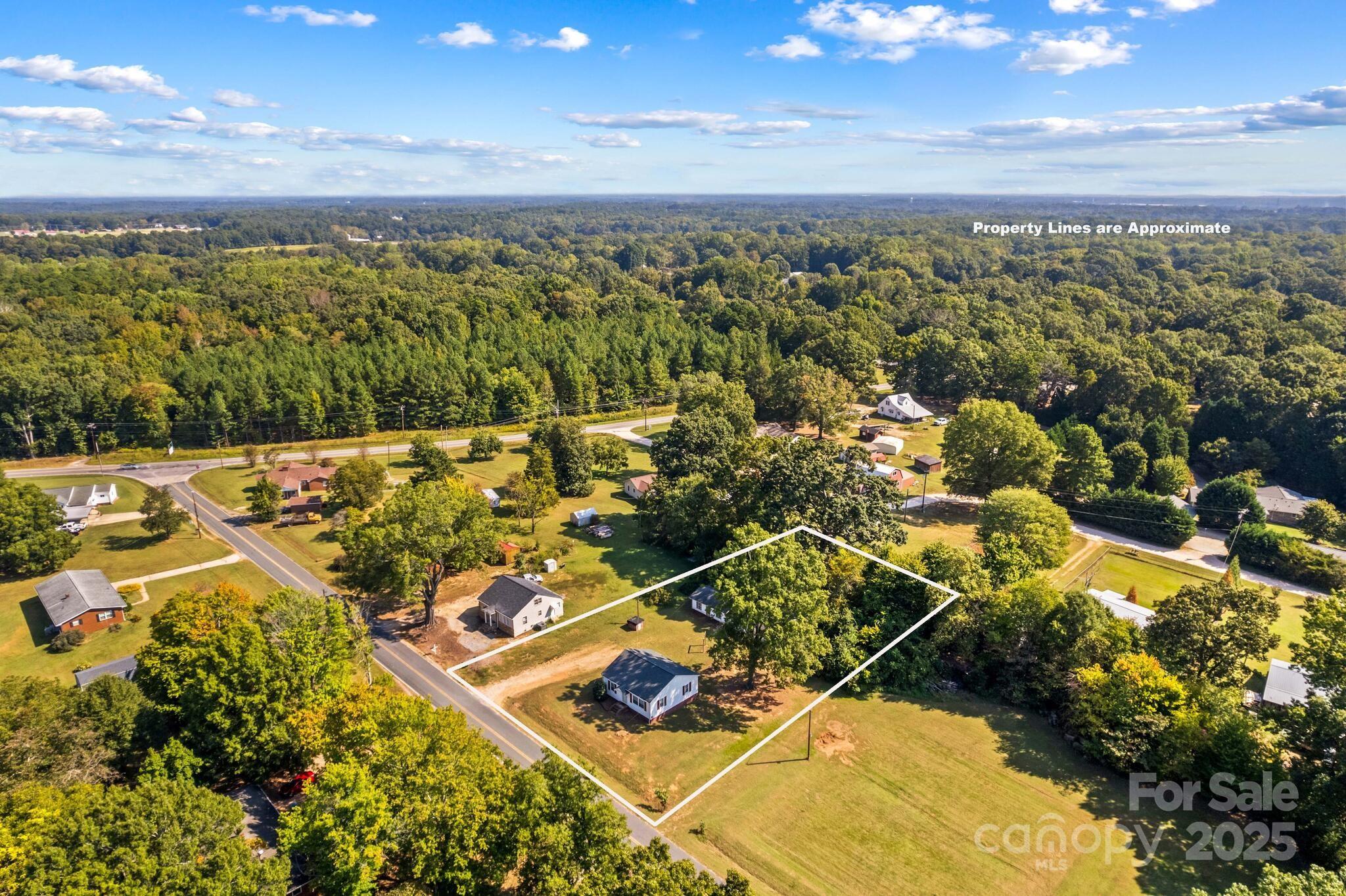 185 Homer Corriher Road China Grove, NC 28023 - Photo 5 of 48 an aerial view of a residential houses with outdoor space