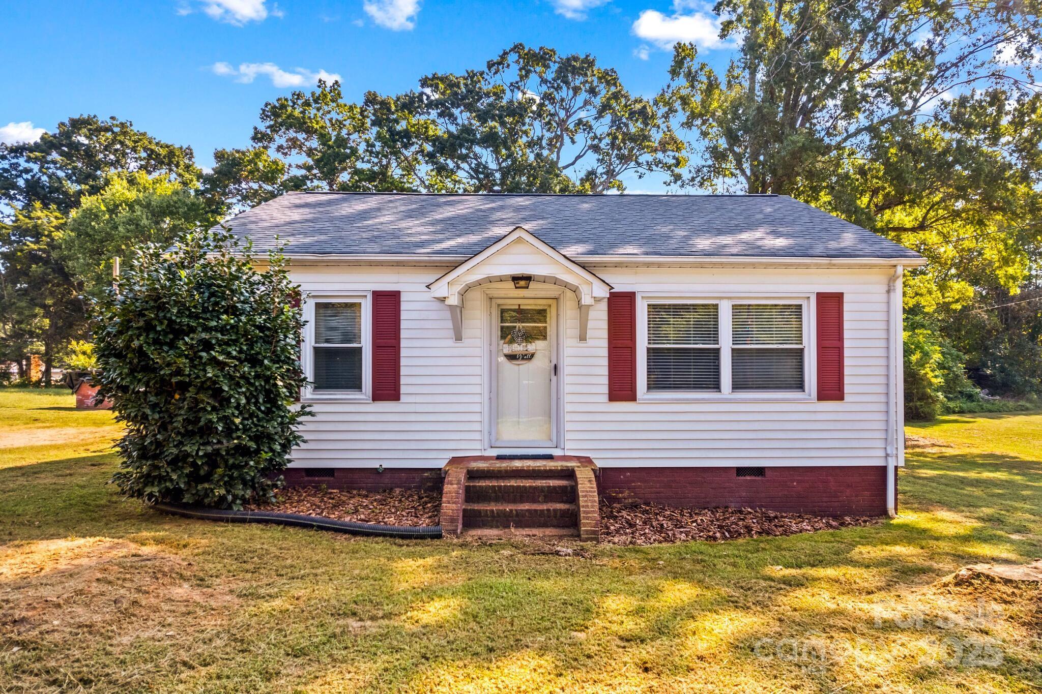 185 Homer Corriher Road China Grove, NC 28023 - Photo 10 of 48 a front view of a house with a yard
