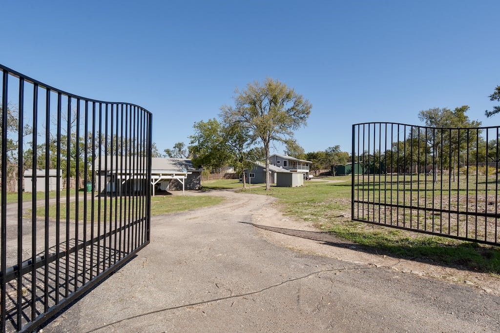 17257 Rocky Ridge Road Austin, TX 78734 - Photo 1 of 1 a view of a gate with a iron gate