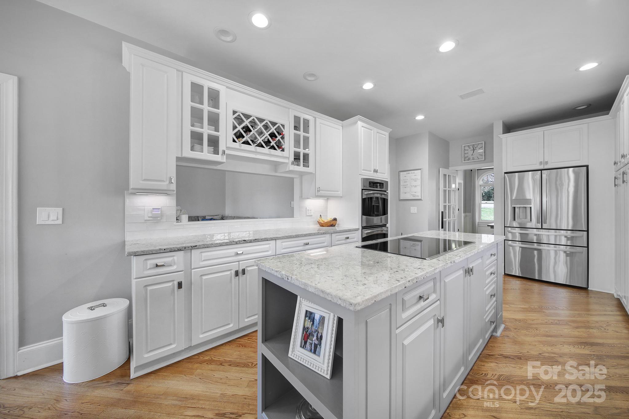 726 Amberly Crossing Fort Mill, SC 29708 - Photo 11 of 47 a kitchen with a stove and cabinets