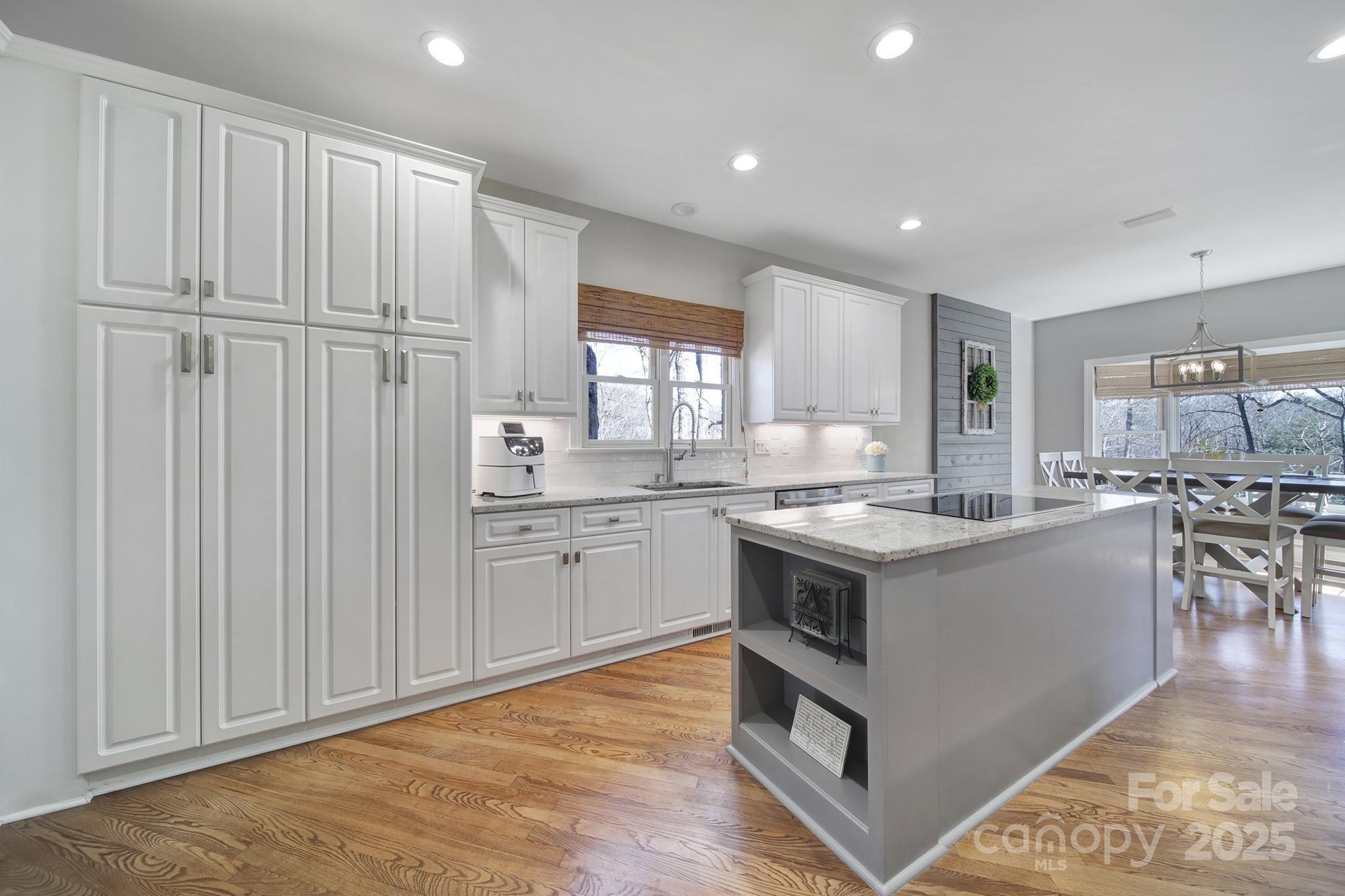 726 Amberly Crossing Fort Mill, SC 29708 - Photo 12 of 47 a kitchen with stainless steel appliances granite countertop a stove and a sink