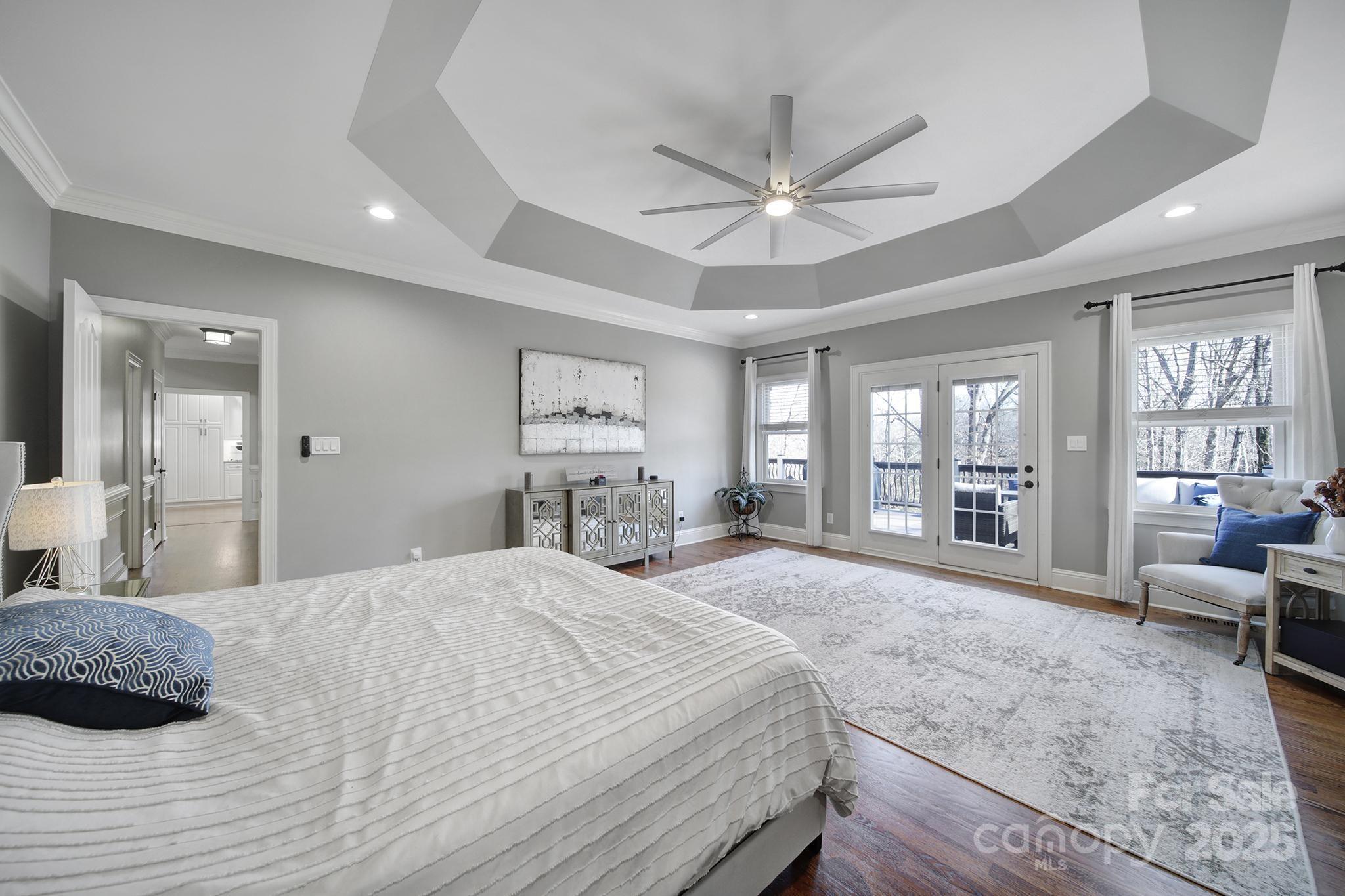 726 Amberly Crossing Fort Mill, SC 29708 - Photo 16 of 47 a spacious bedroom with a large bed and a large window