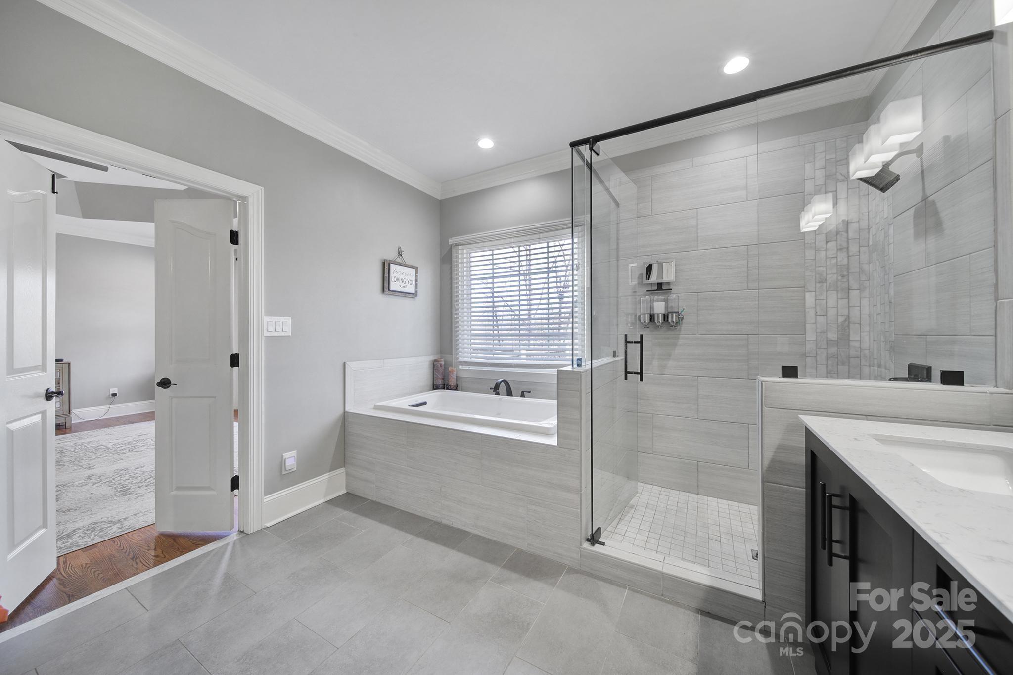 726 Amberly Crossing Fort Mill, SC 29708 - Photo 19 of 47 a bathroom with a bathtub shower sink and mirror
