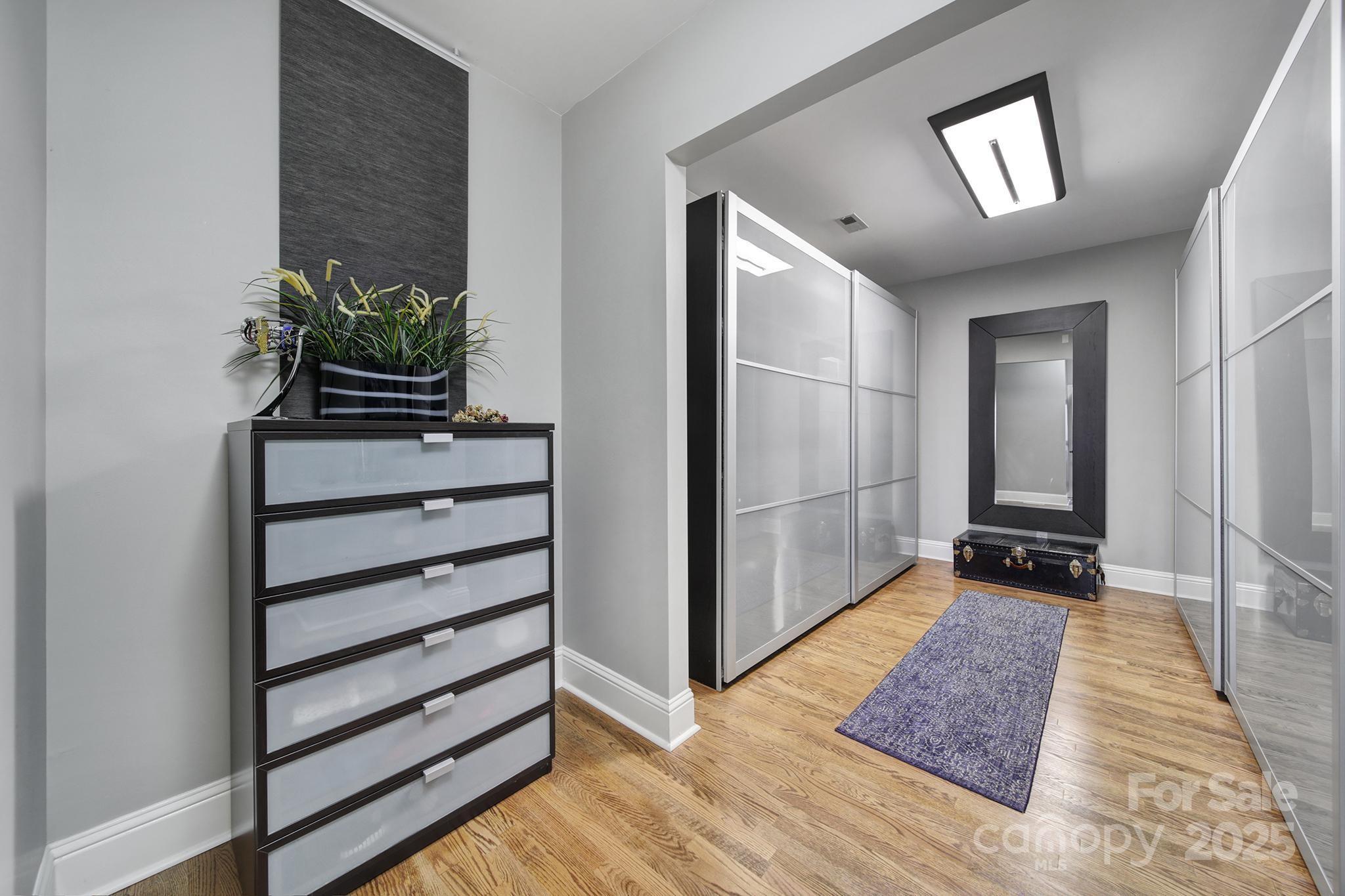 726 Amberly Crossing Fort Mill, SC 29708 - Photo 20 of 47 a view of a hallway with closet and a potted plant
