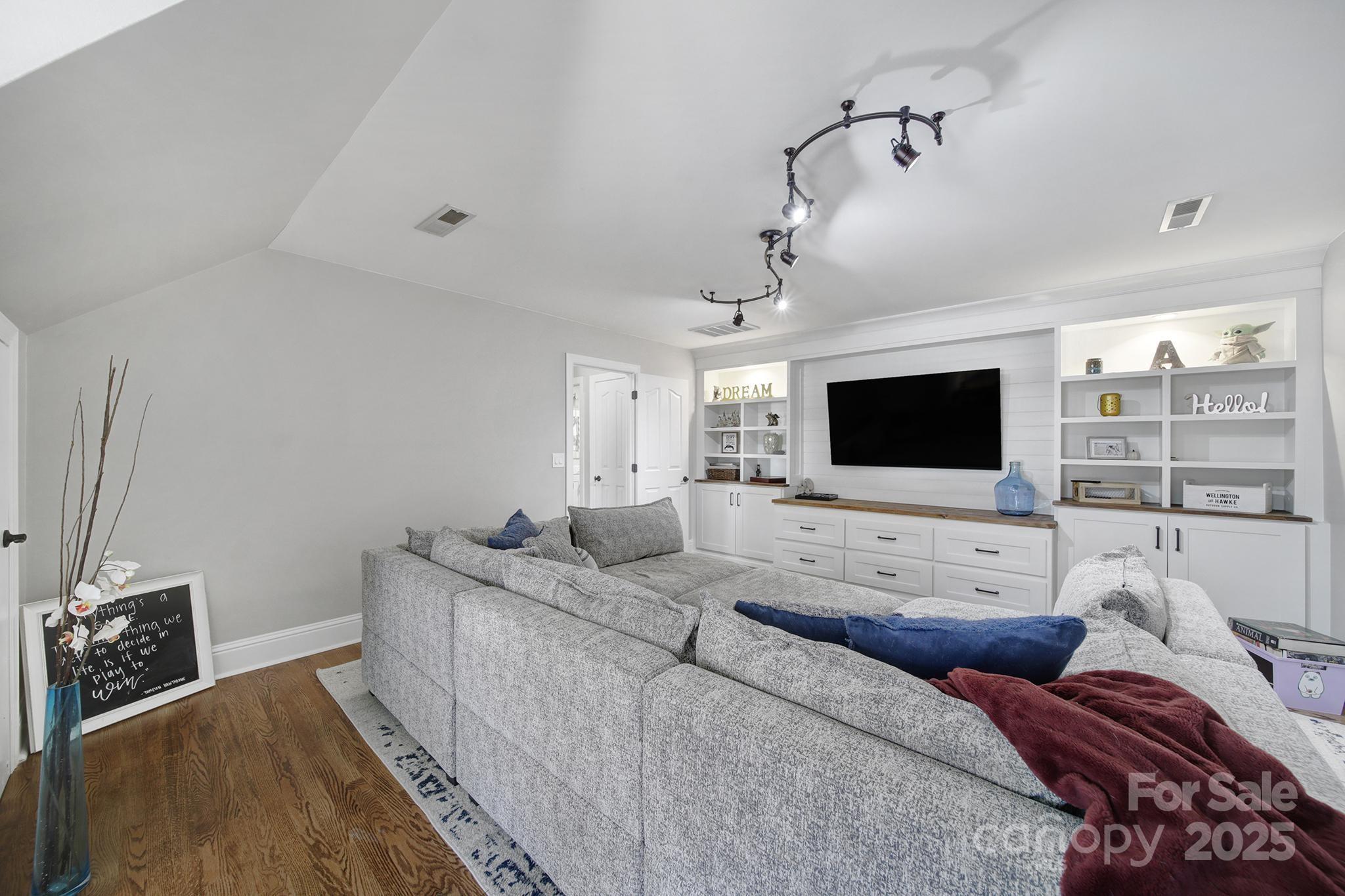 726 Amberly Crossing Fort Mill, SC 29708 - Photo 30 of 47 a living room with furniture and a flat screen tv