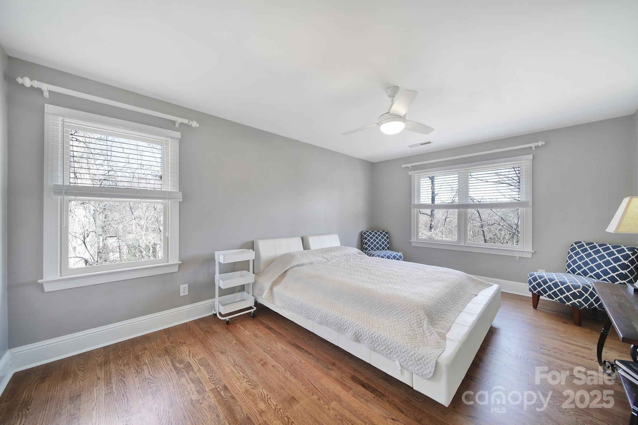 726 Amberly Crossing Fort Mill, SC 29708 - Photo 31 of 47 a bedroom with a bed wooden floor and window