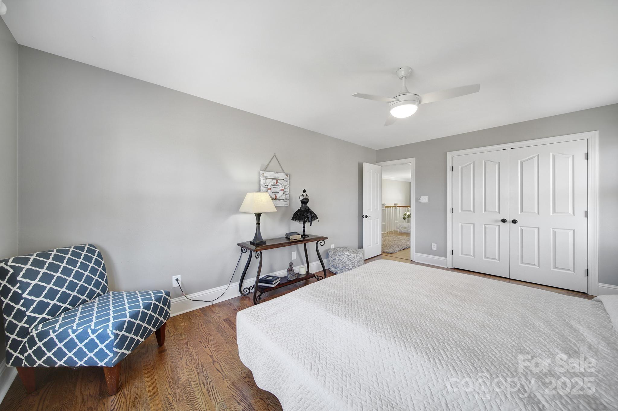 726 Amberly Crossing Fort Mill, SC 29708 - Photo 32 of 47 a bedroom with a bed and a chandelier