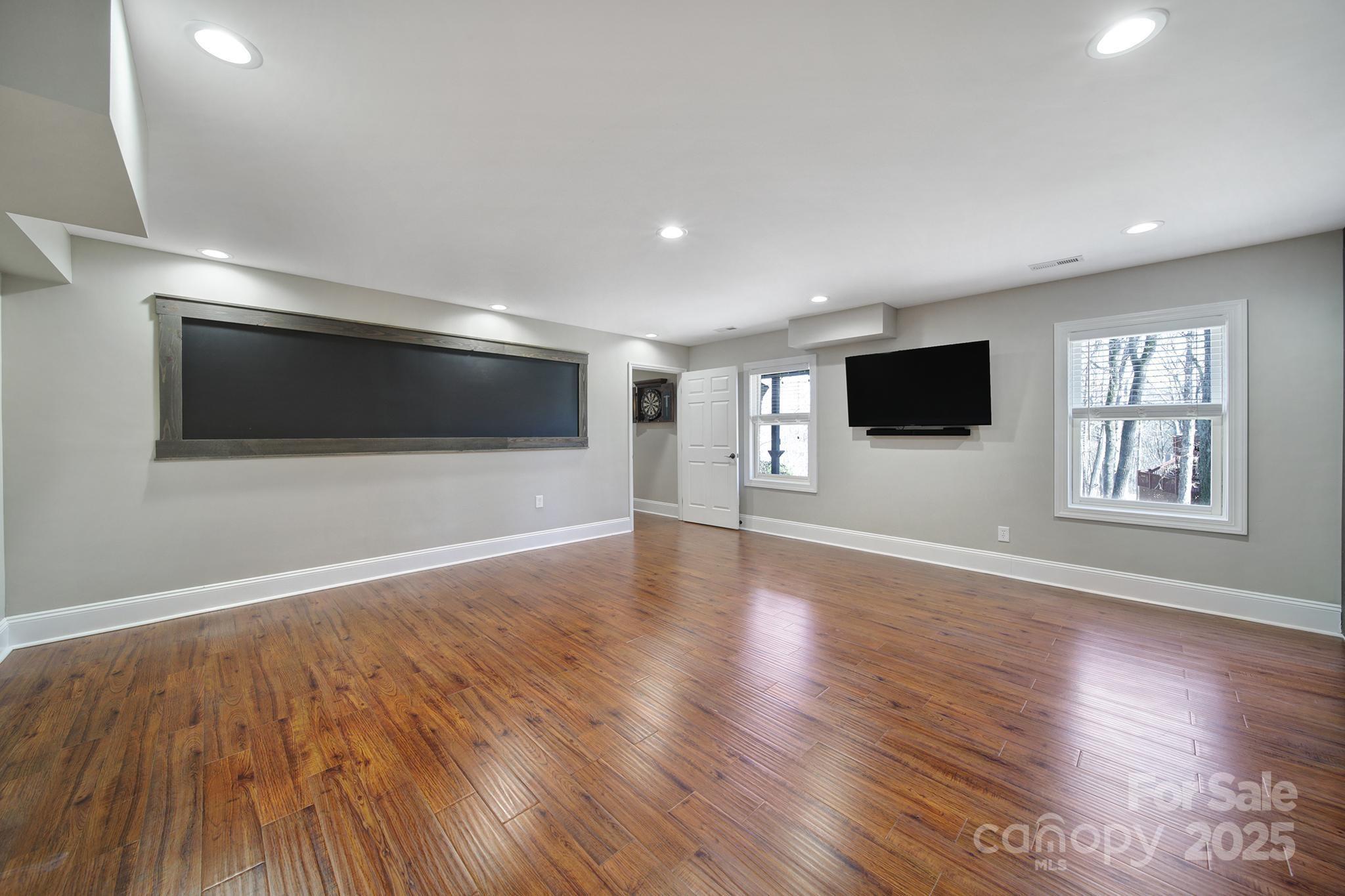 726 Amberly Crossing Fort Mill, SC 29708 - Photo 41 of 47 a view of an empty room with wooden floor and a window