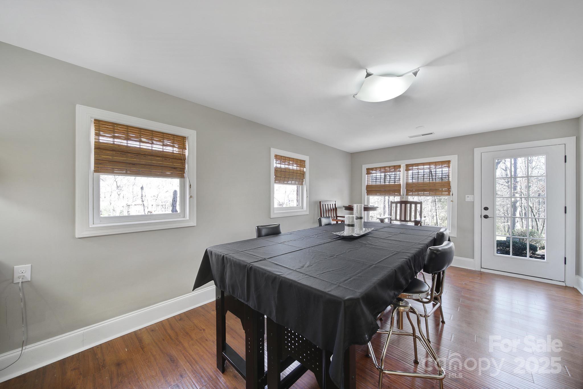 726 Amberly Crossing Fort Mill, SC 29708 - Photo 44 of 47 a view of a dining room with furniture wooden floor and chandelier