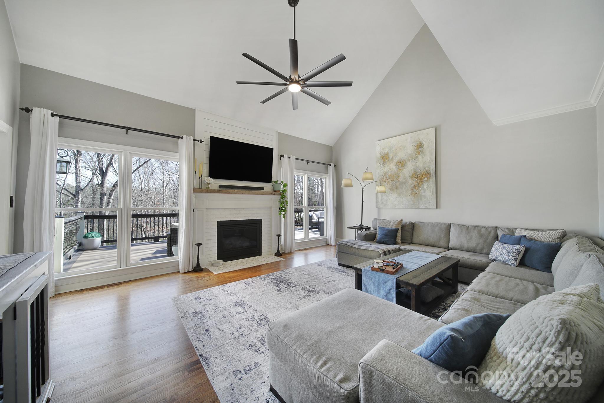 726 Amberly Crossing Fort Mill, SC 29708 - Photo 6 of 47 a living room with furniture a fireplace and a flat screen tv