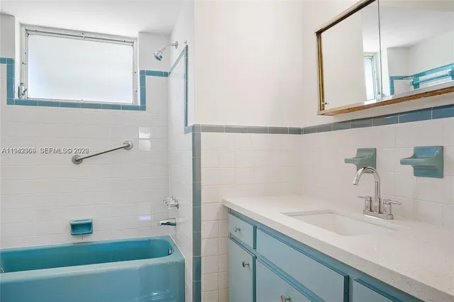 a bathroom with a sink and a bathtub