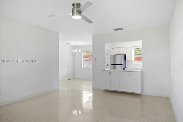 a view of a kitchen with a sink and cabinet